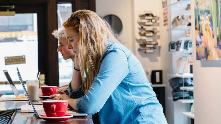 Students studying at a cafe.