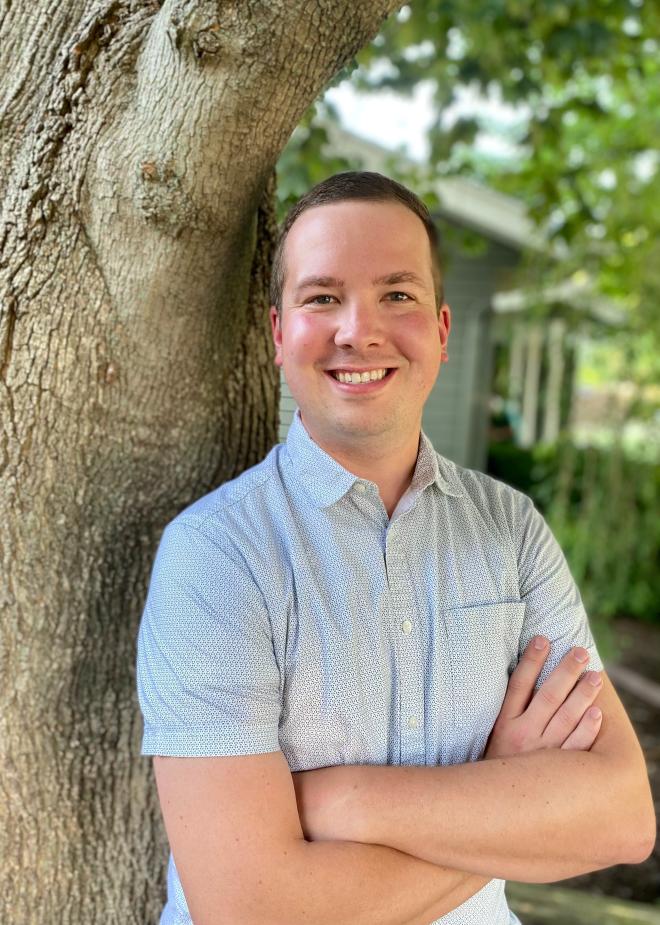 Caleb Lagerwey standing near a tree and smiling