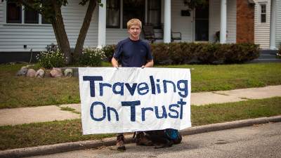 Josh deLacy '13 holds up a banner that reads 