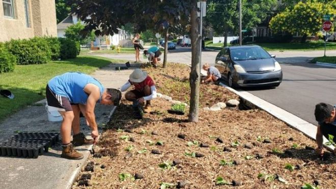 Volunteers with Plaster Creek Stewards work on a project in Grand Rapids, Michigan.