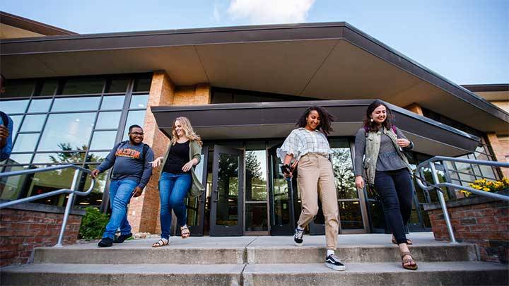 Calvin University students walking out of the Covenant Fine Arts Center on campus in Grand Rapids, Michigan