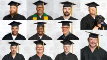 A photo montage of 11 men in caps and gowns who graduated from the Calvin Prison Initiative.