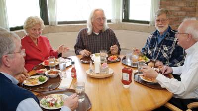 Calvin faculty gather for lunch and conversation on campus.