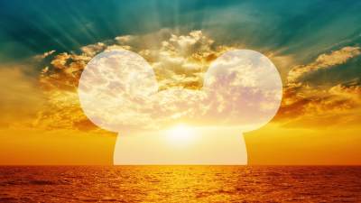 Sunset with silhouette of Mickey Mouse ears.