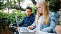 Calvin University students studying outside on campus in Grand Rapids, Michigan