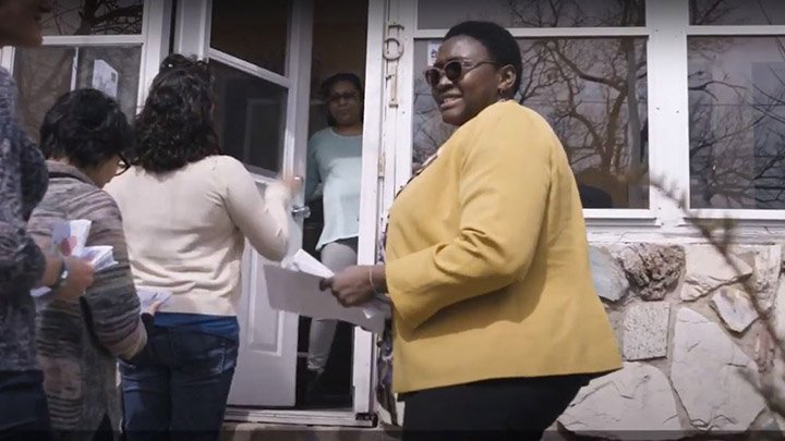 A professor and students visit a house in a Grand Rapids, Michigan neighborhood.