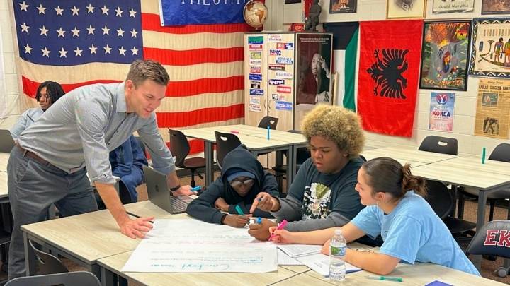 History teacher Matt Vriesman works with students at East Kentwood High School