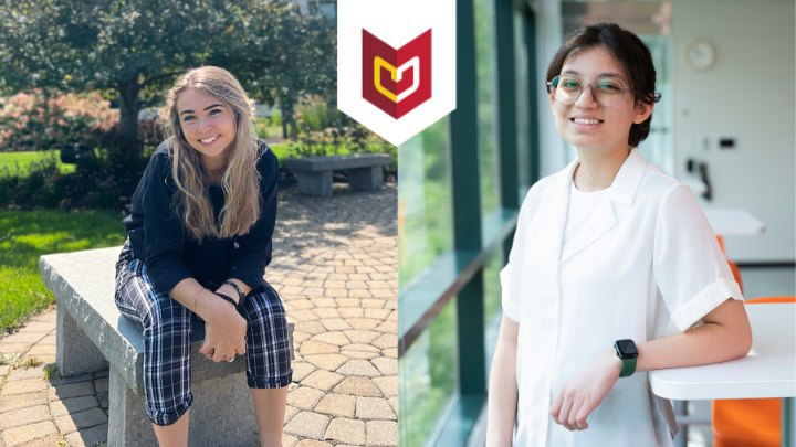 Two intern students. One seated on a bench, the other leaning on a table.