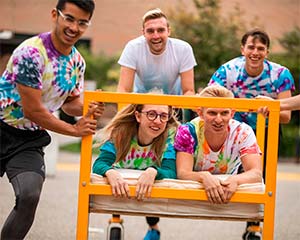 Five students racing with a bed!